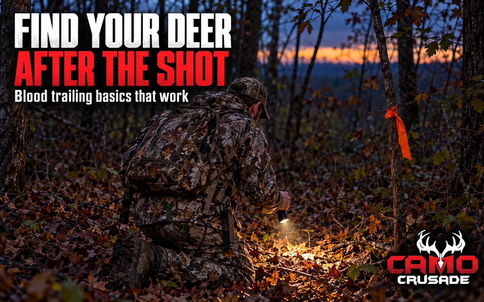 A hunter in camo kneels beside orange flagging tape tied to a sapling in a Southern hardwood bottom, studying the leaf litter with a flashlight at dusk.